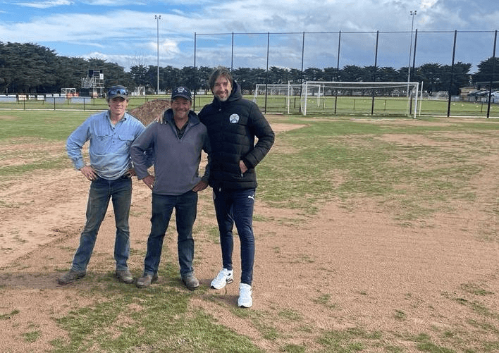 Volunteer groundskeepers maintaining the playing surface at Elcho Park.