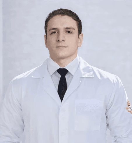 man in white dress shirt wearing black framed eyeglasses