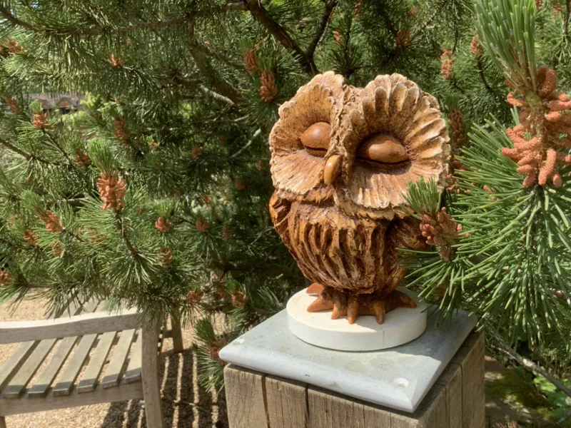 phantasmagoric owl sculpture in garden