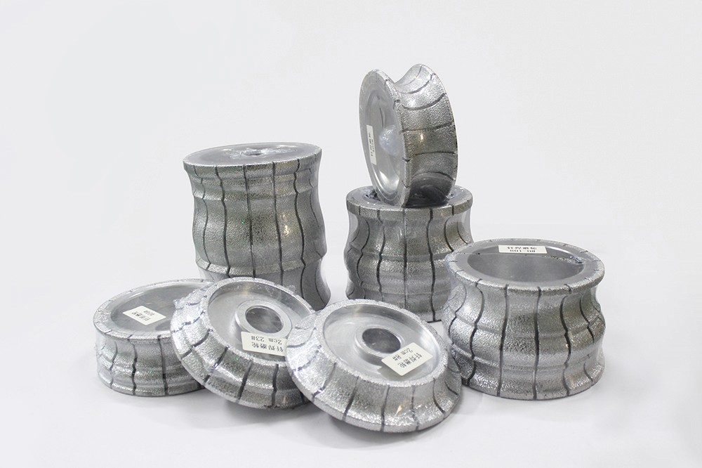 Diamond Profiling Wheels stacked in various positions, showcasing different shapes and designs.