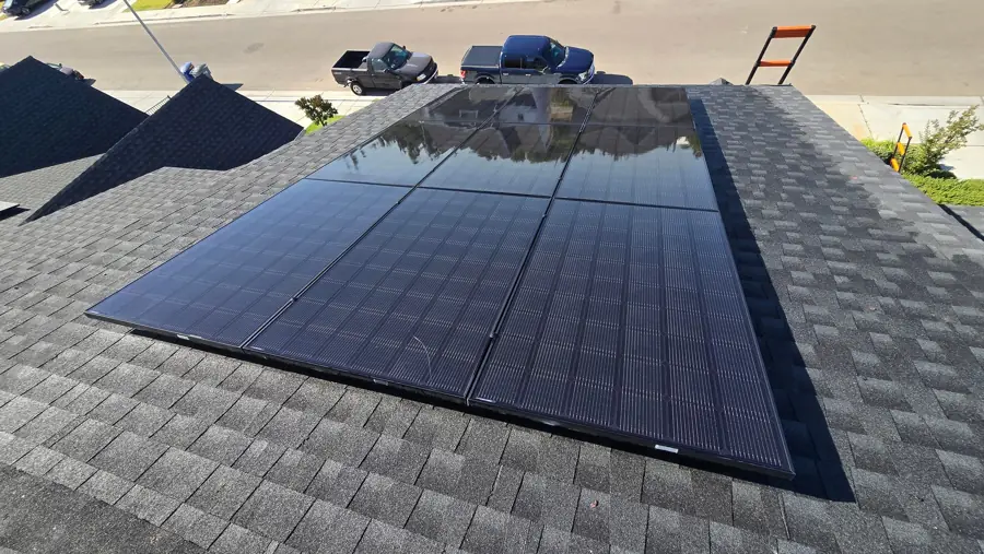 Black solar panels on a shingle home roof