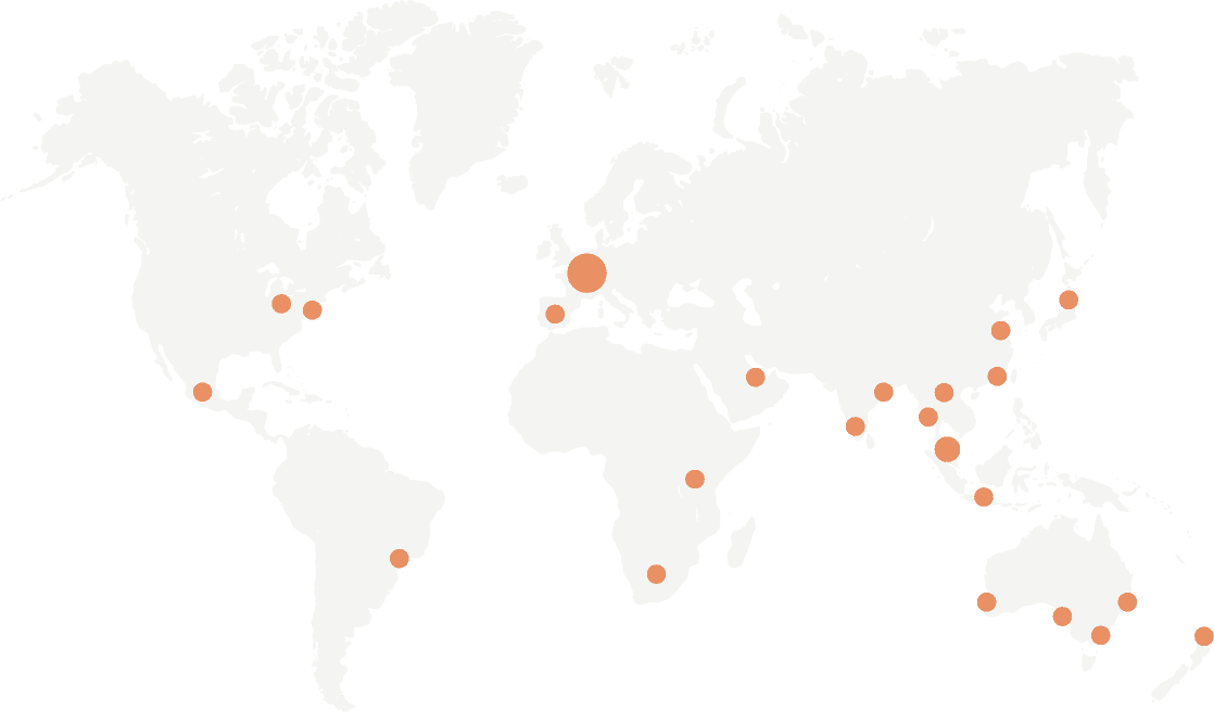 World map with highlighted orange dots representing key locations in the global network, showcasing international presence and operations.