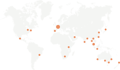 World map with highlighted orange dots representing key locations in the global network, showcasing international presence and operations.