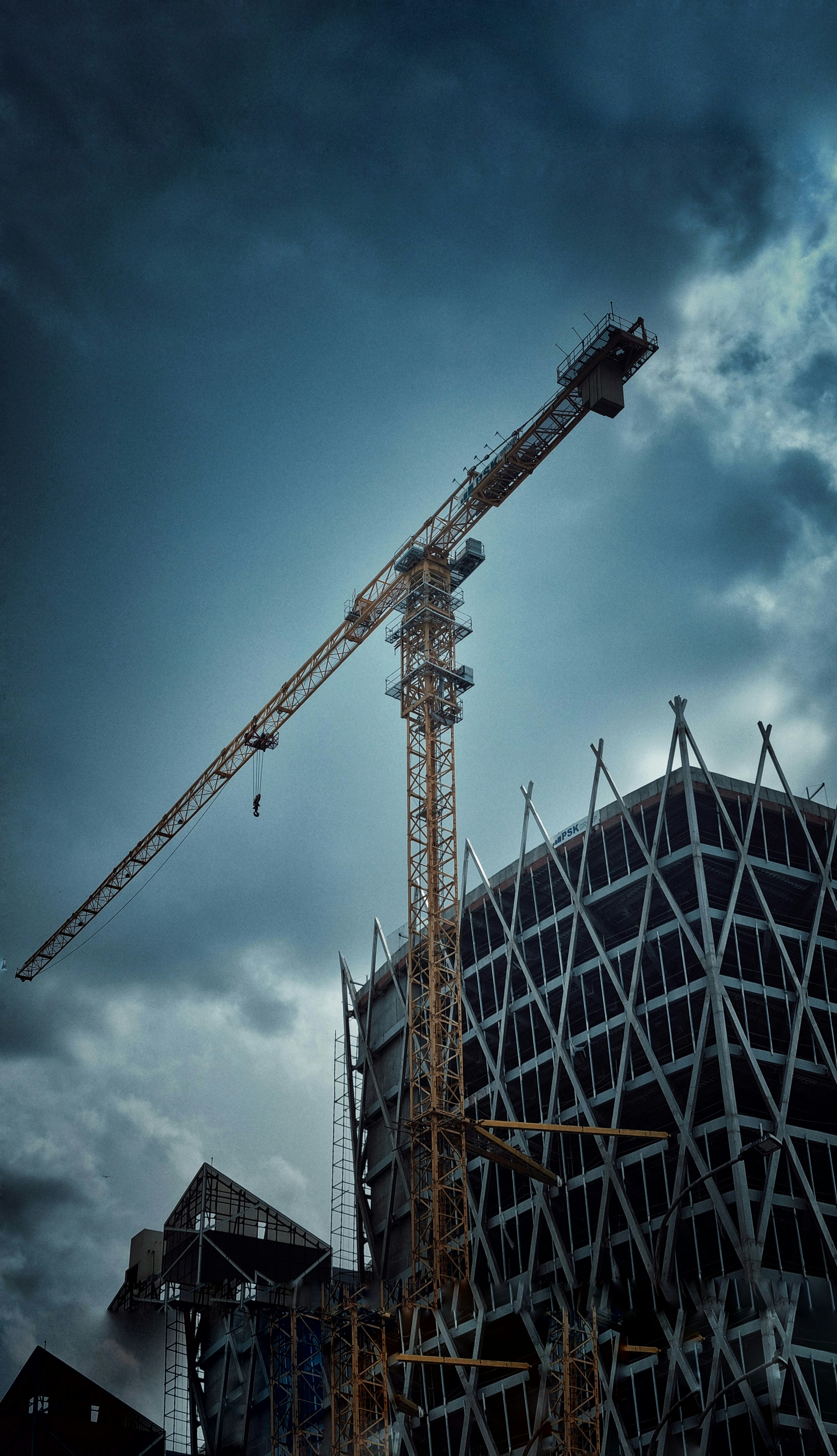 a crane next to a building