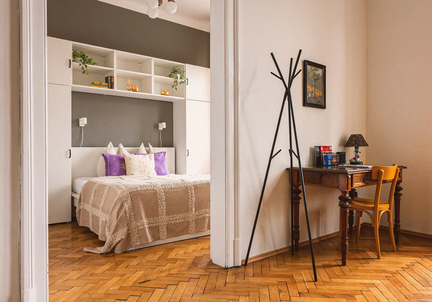 Boutique N°4 • view from the living area into the bedroom with a double bed and built-in shelves
