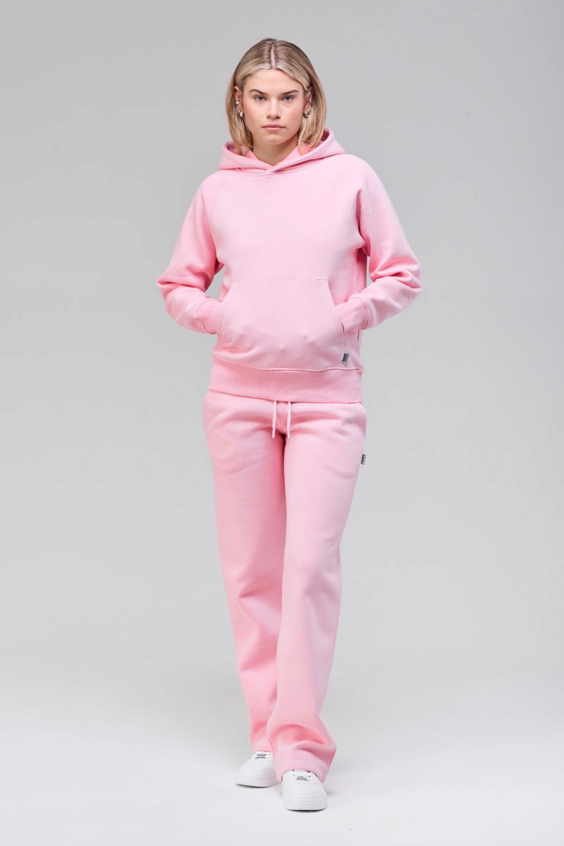 Model wearing pink classic hoodie, front full figure