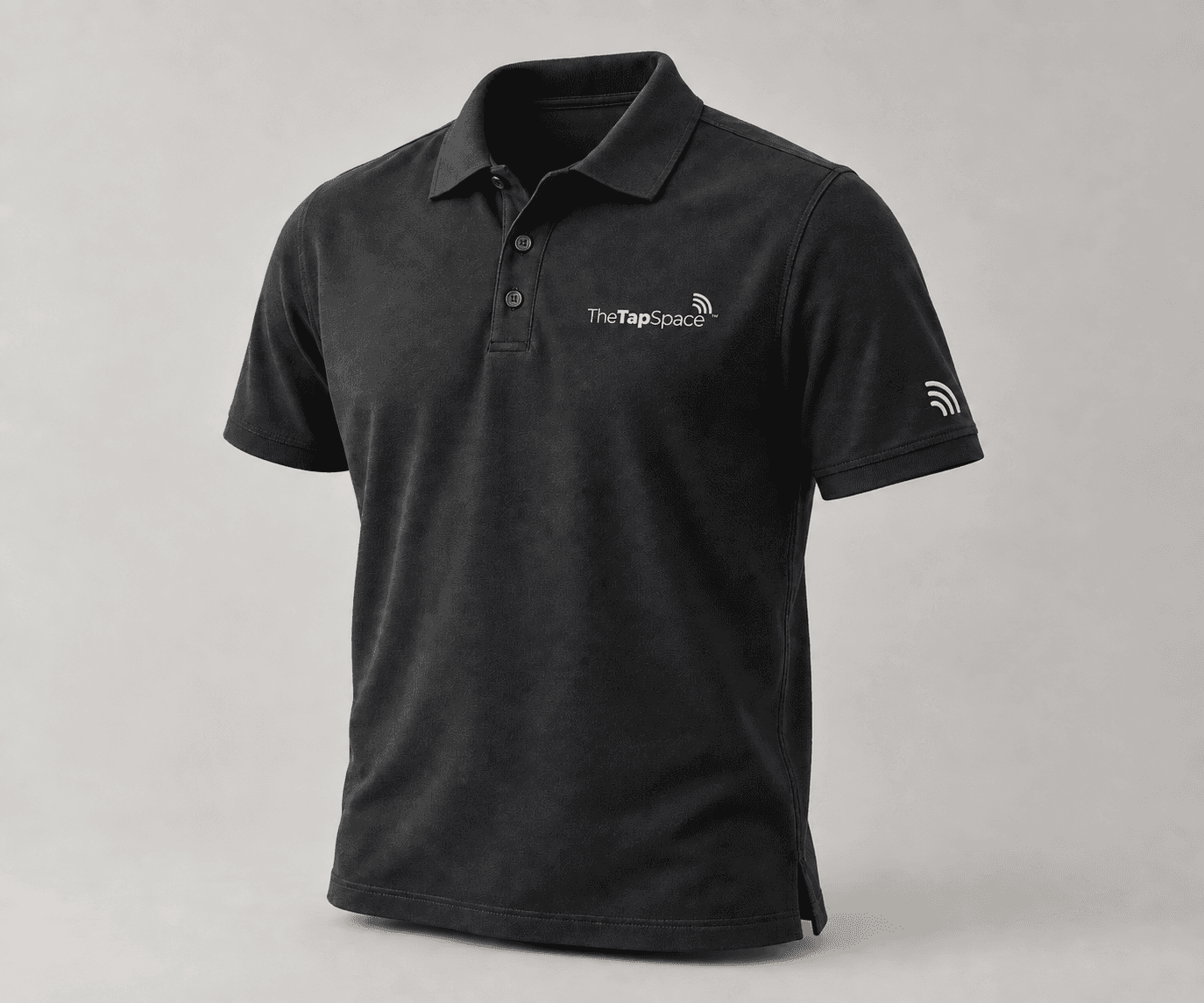 Black polo with white TheTapSpace chest logo and signal sleeve mark