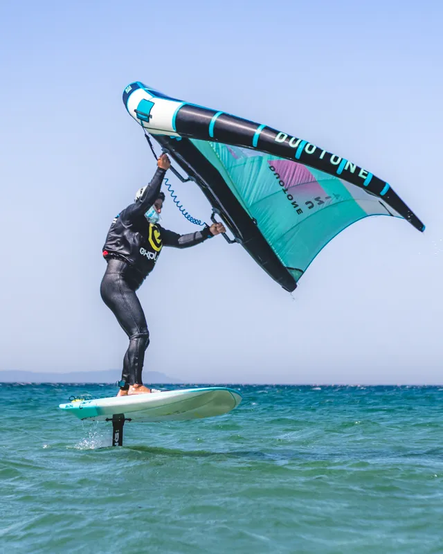Student successfully lifting on hydrofoil wing board at Explora Watersports Tarifa
