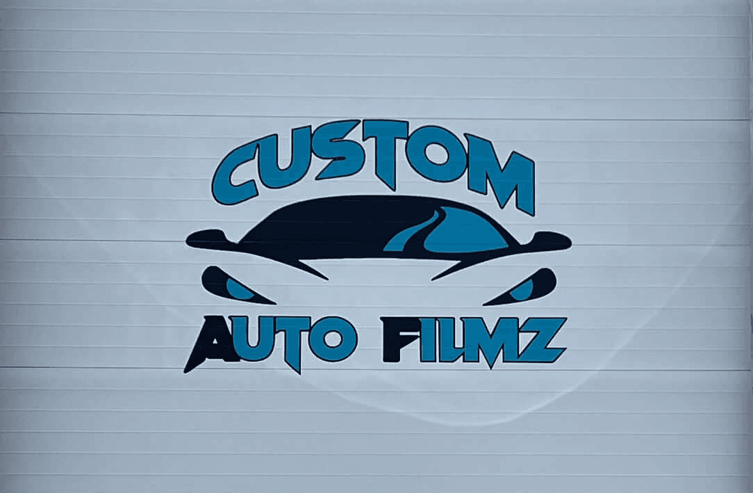 A garage door with custom vinyl business graphics.