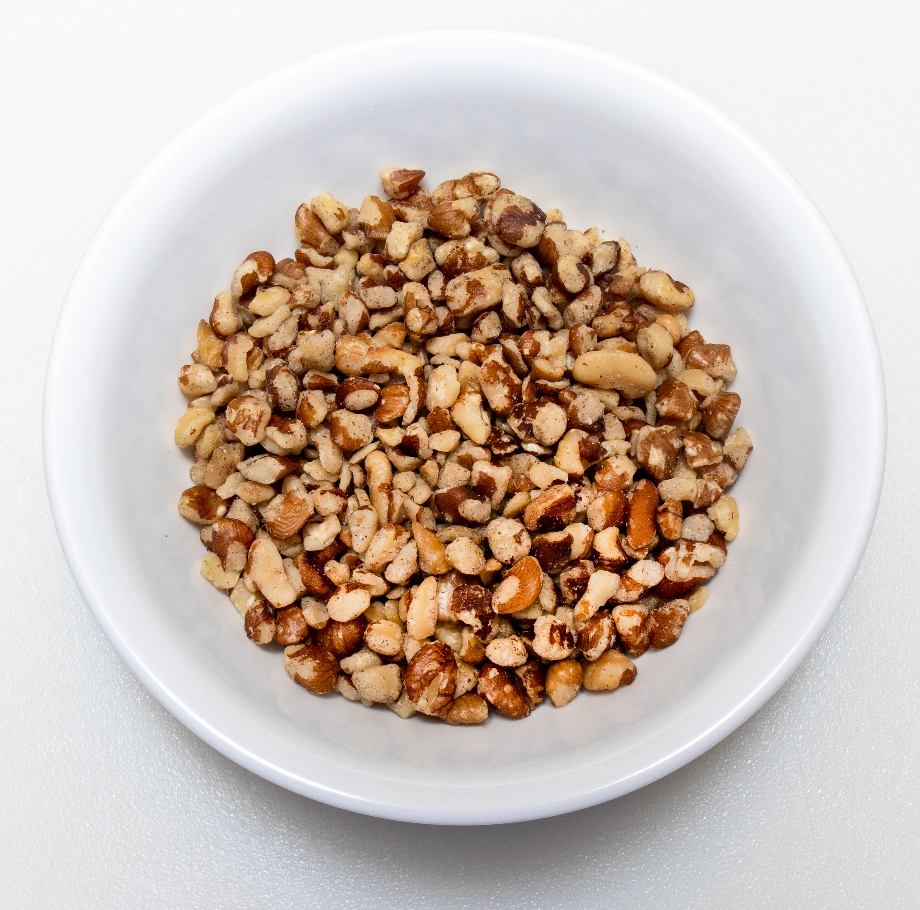 Group of students processing acorns together during a foraging class, representing shared learning and scholarship.
