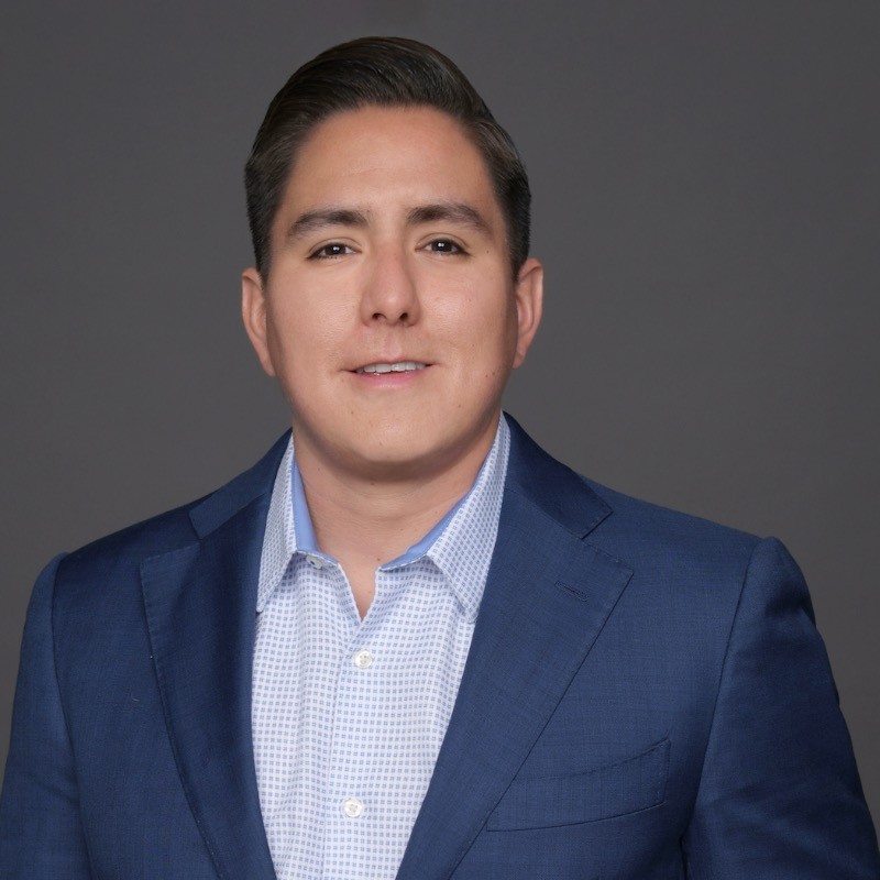 person writing on a piece of paper 