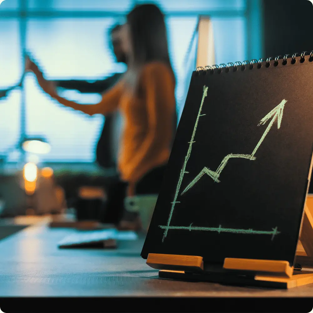 Graph showing upward trend on a blackboard