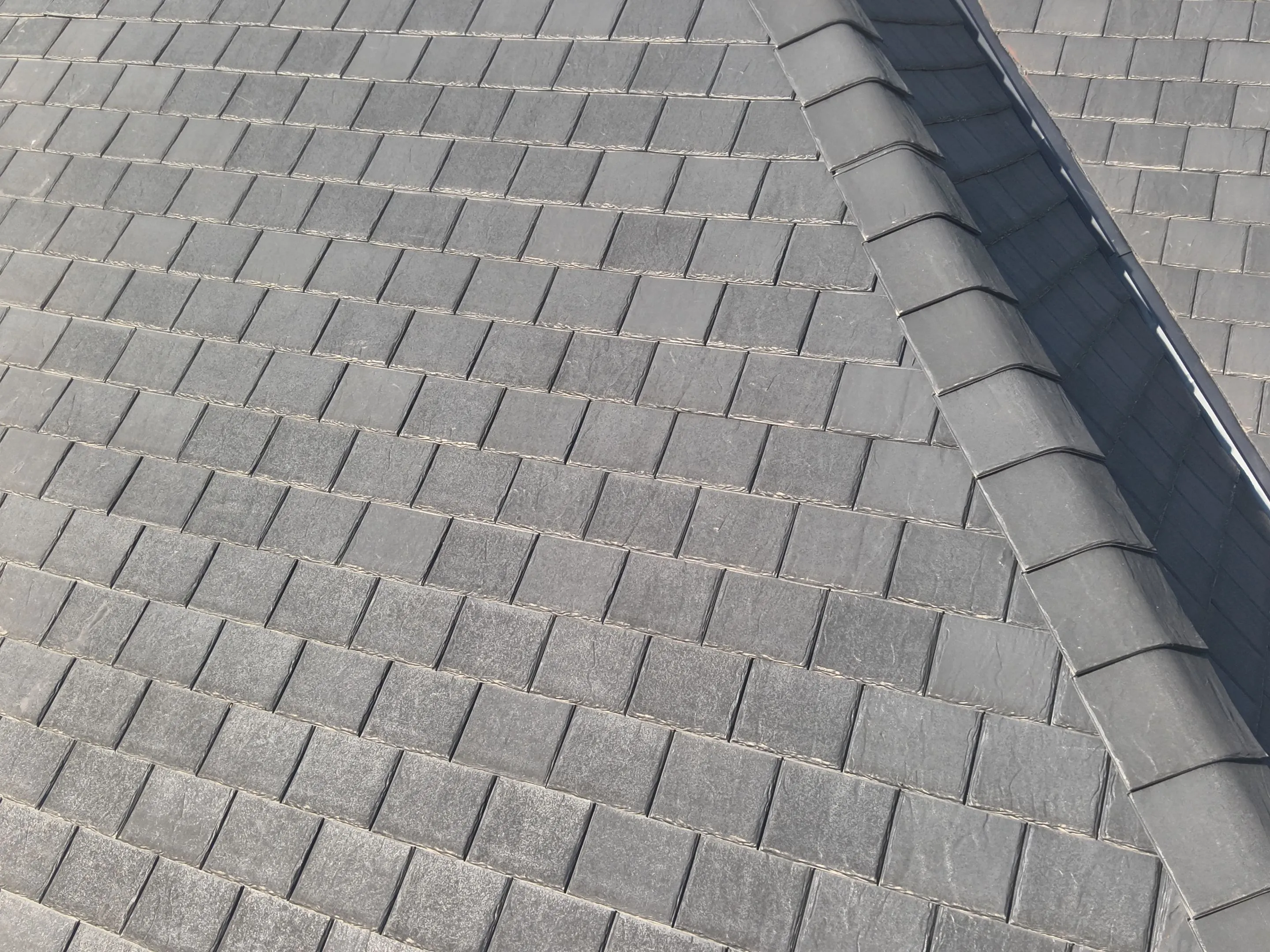 Detailed view of F-Wave synthetic roofing shingle pattern and texture demonstrating superior craftsmanship in Corinth TX