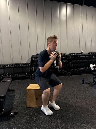 man in black hoodie standing