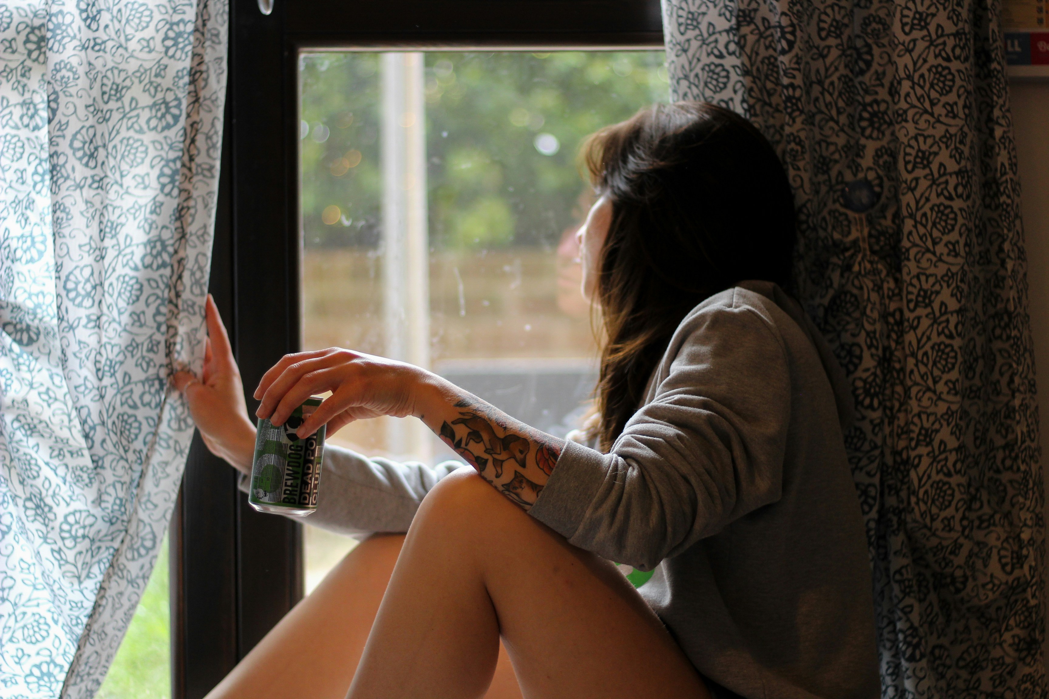 Girl Sitting beside a Window - Best Colors for Light Brown Skin