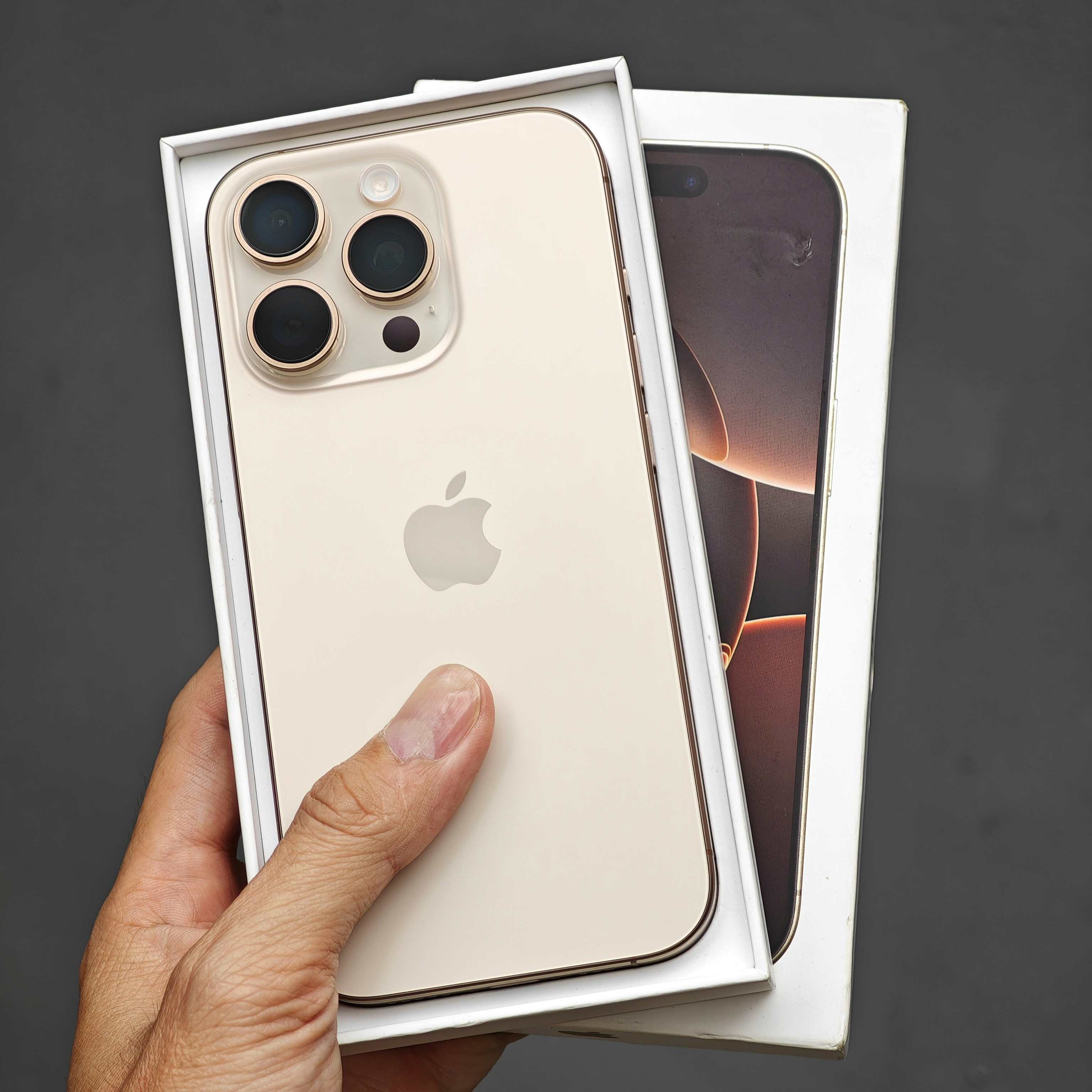 A person holding a white iPhone case in their hand
