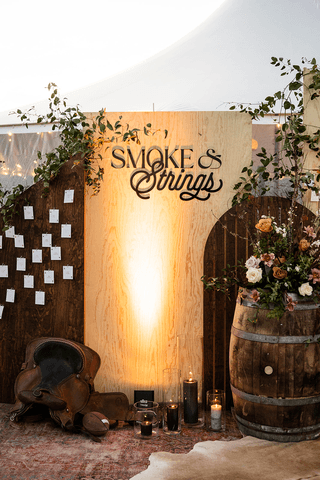 A beautifully decorated wedding cake featuring red and white roses.