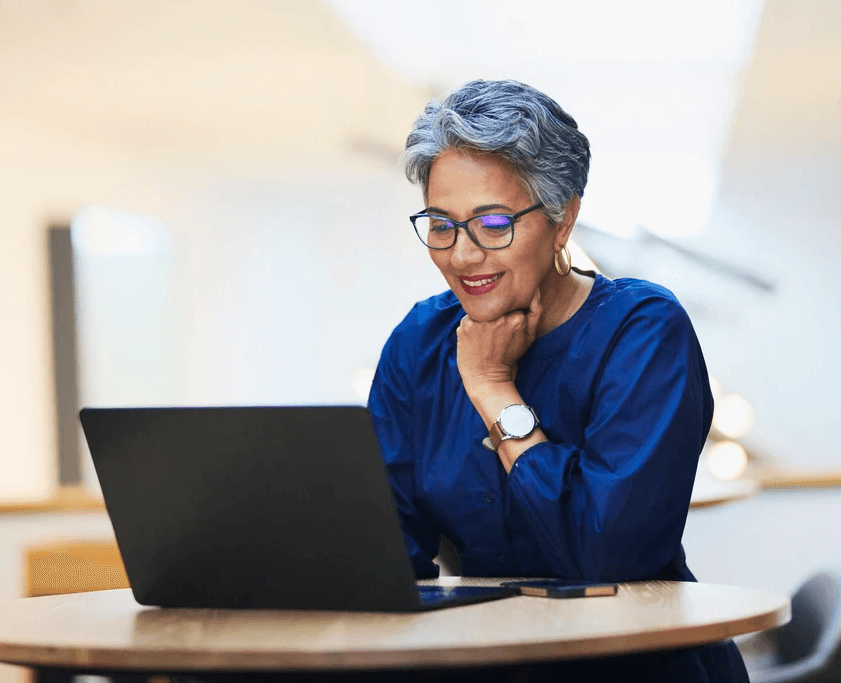 Senior using laptop computer viewing SEO search results