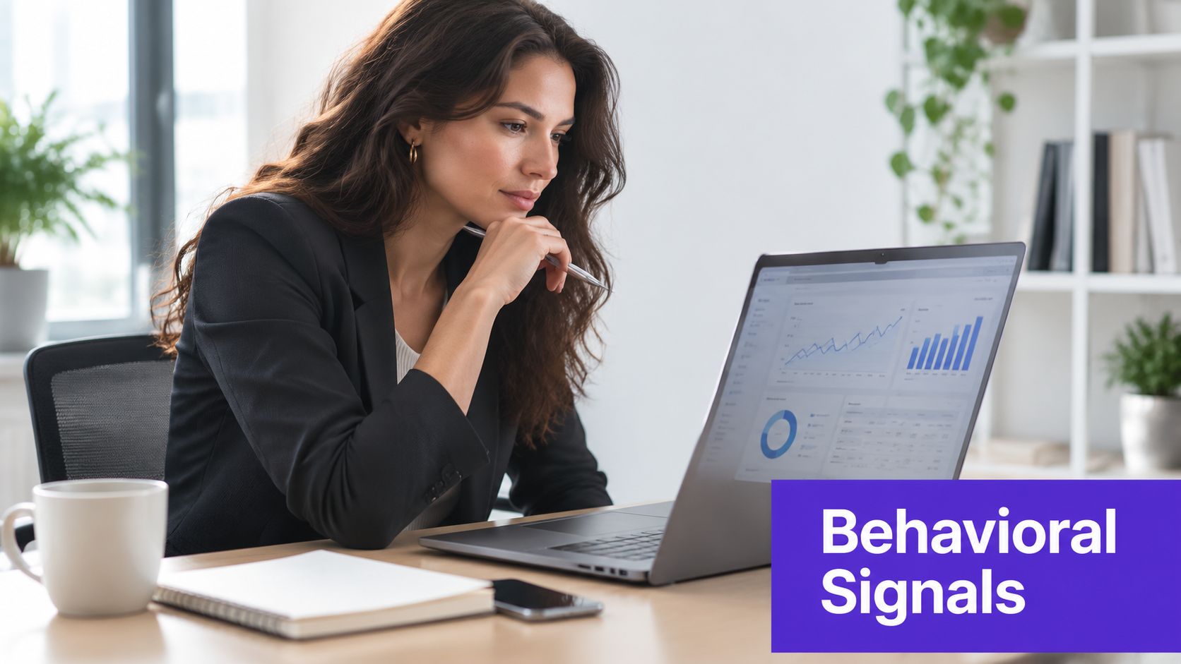 A professional woman in a suit looking thoughtfully at data charts on her laptop screen.