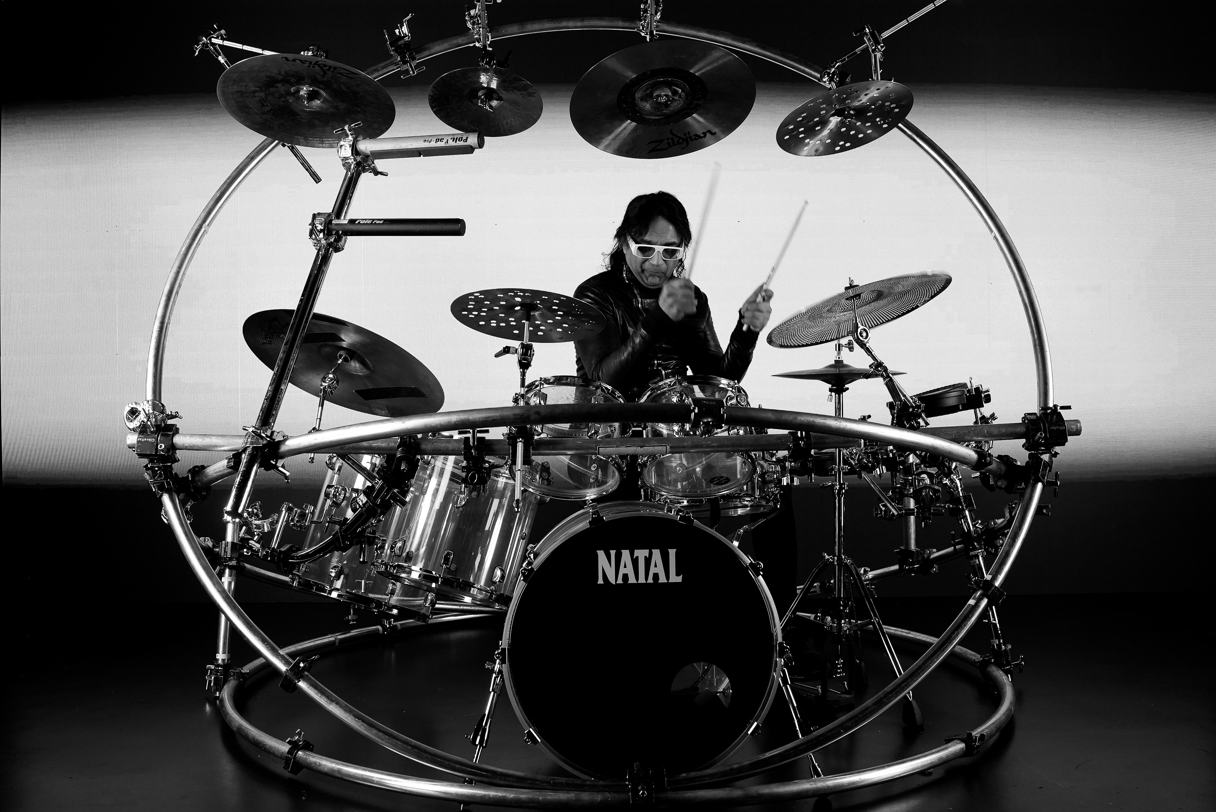a man standing in a dark room with a red light