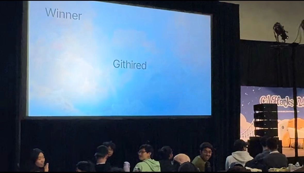 a black and white living room with a large tv