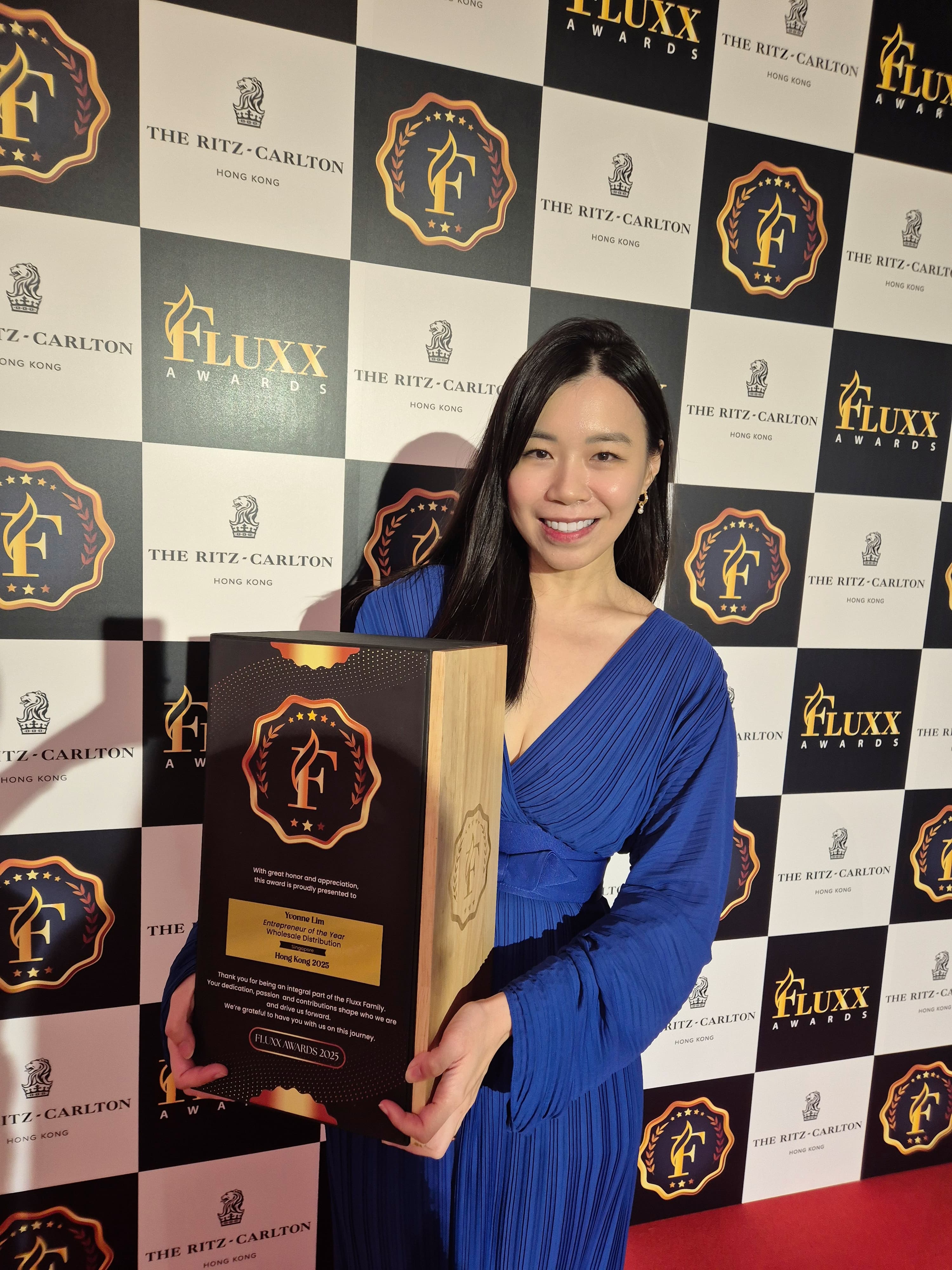 woman in black crew neck t-shirt wearing brown framed eyeglasses standing on rocky shore during