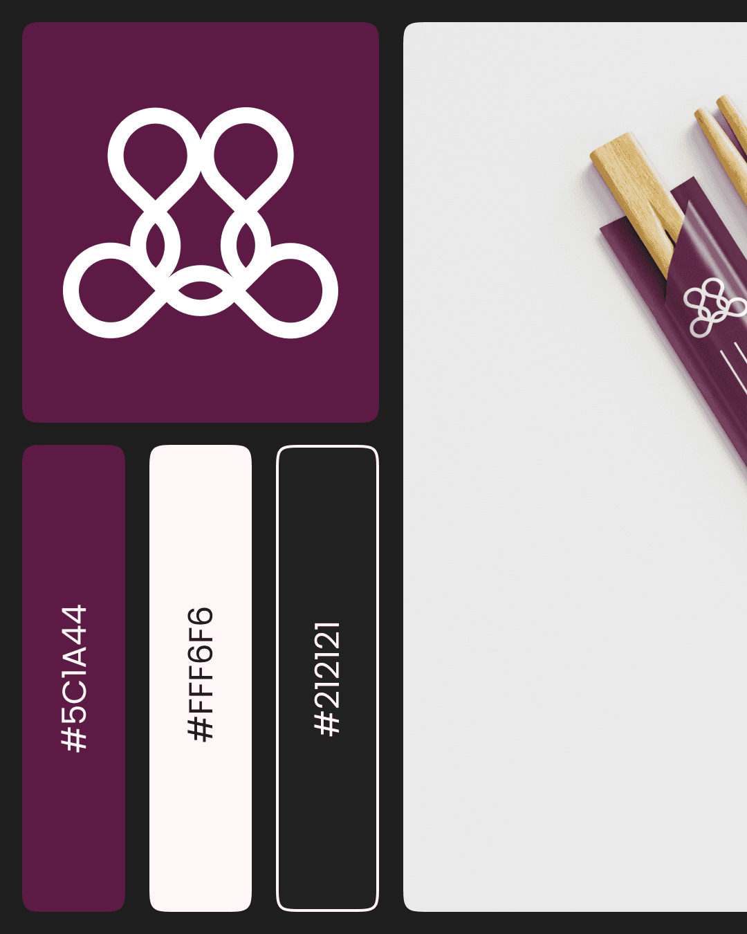 Modern architectural workspace with large floor-to-ceiling windows, surrounded by trees, and desks filled with design materials and books. Two blurred figures are walking through the space.