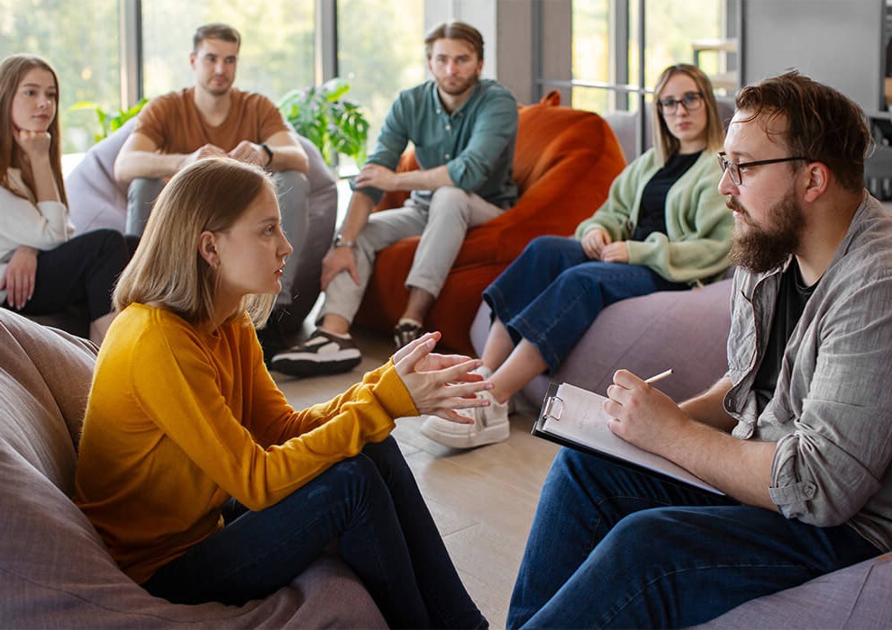 Conversion Truth for Families: Group of youths sitting in a circle on chairs