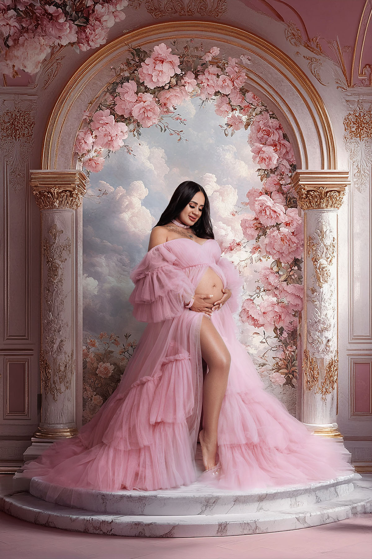 Bloom N’ Baby Studio maternity session with a fluffy pink gown and gentle studio lighting.