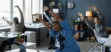 a group of people doing yoga on a beach