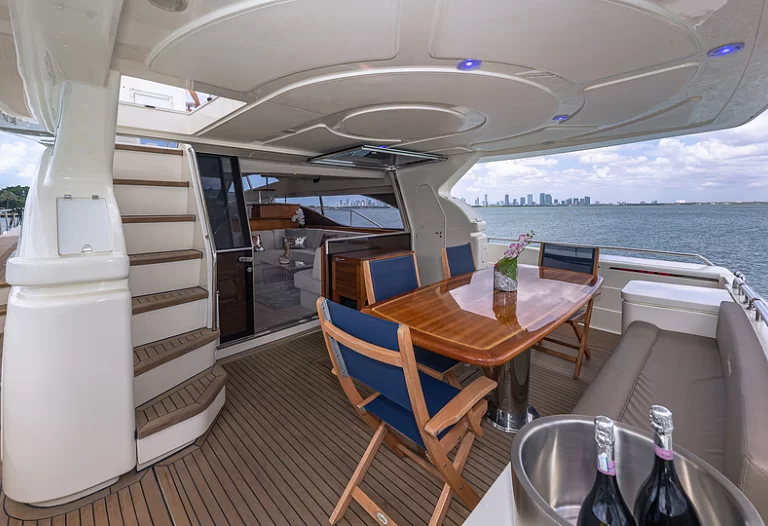 Elegant main salon of the Ferretti Lumar yacht with panoramic sea views.