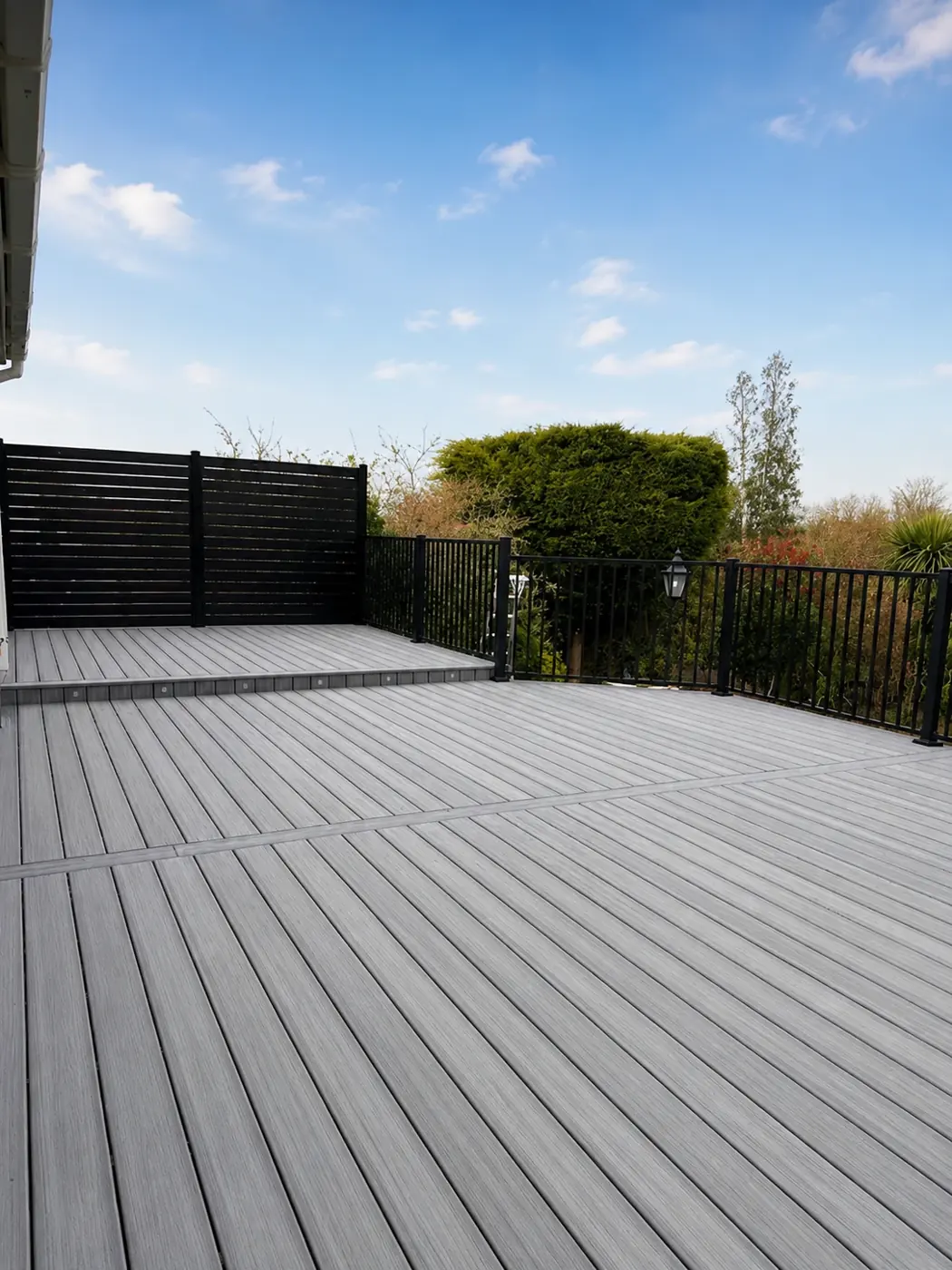Large grey Trex roof terrace with black railings