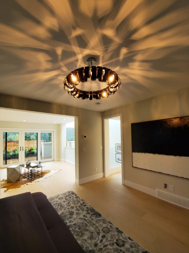 Image of Luxury living room interior design by KHD Homes featuring modern furniture and elegant layout design elements.