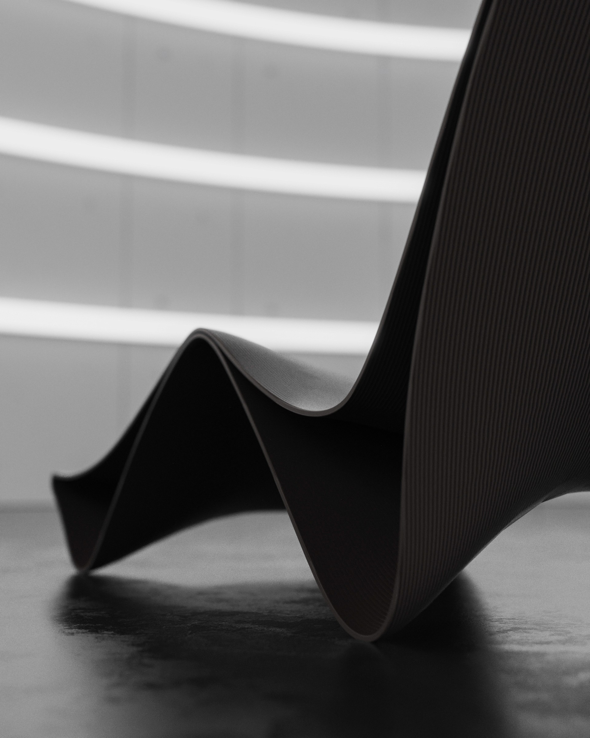 Dramatic moody curves of the Curva Chaise designed by noknok studio