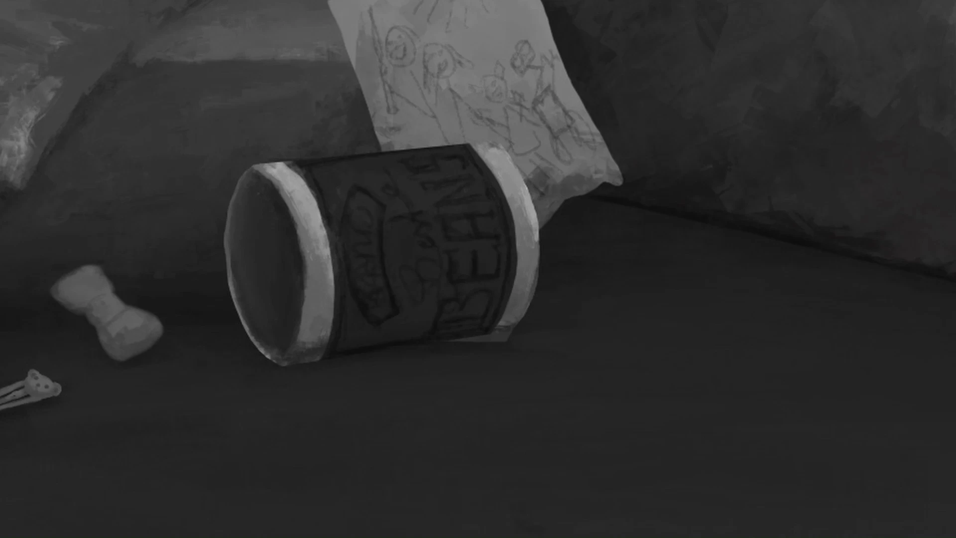 An empty can of dogfood is lying on the ground