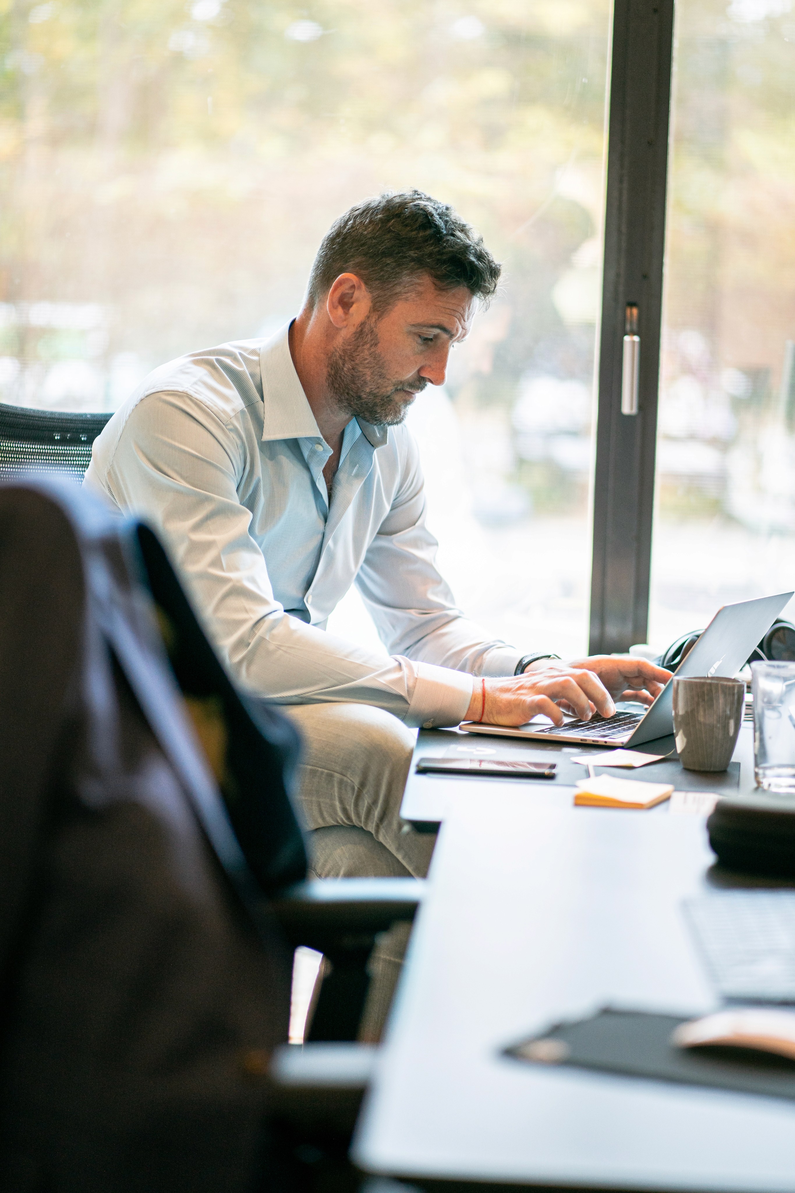 Man sitting in the office using his computer.