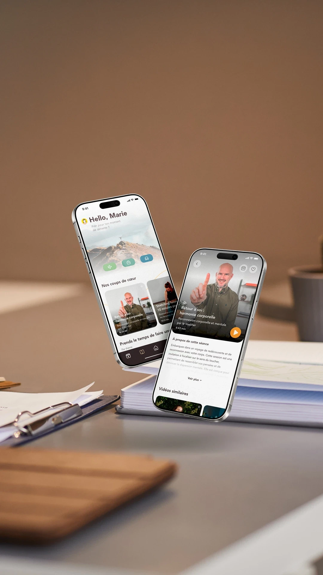 Deux smartphones affichant l’app Mybreak+ sur un bureau de travail.