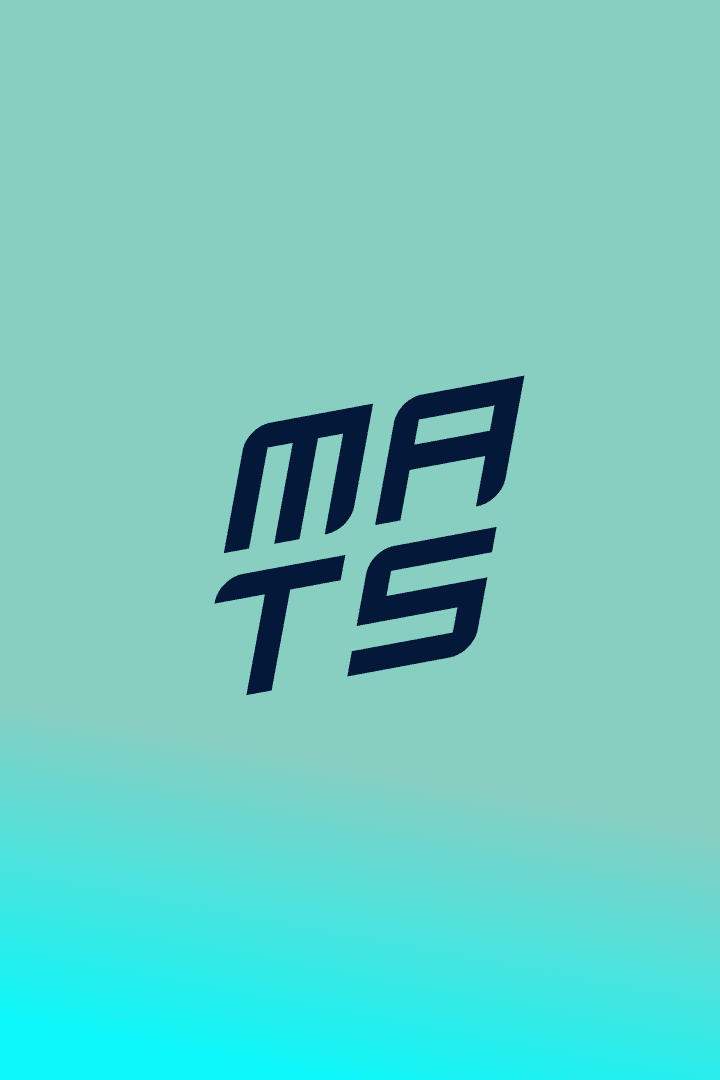 Smiling young man with short hair poses against a dark background, wearing a green button-up shirt.