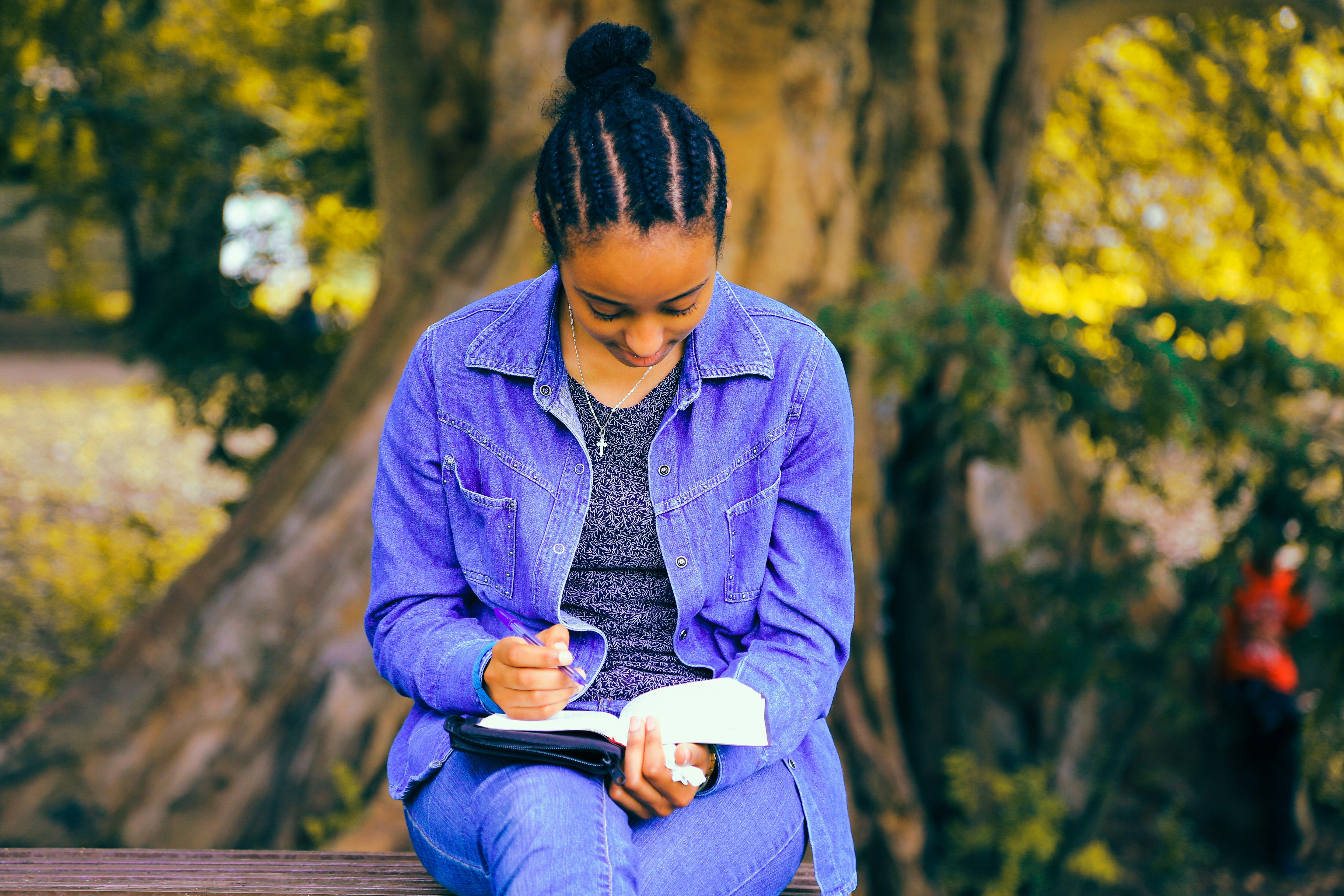 Girl wearing Hand Free Reading a Book- Saving Nora Audiobook Free