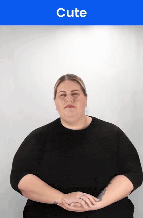 Animated GIF: a Deaf signer signs CUTE in ASL, two fingertips brushing down the chin twice.