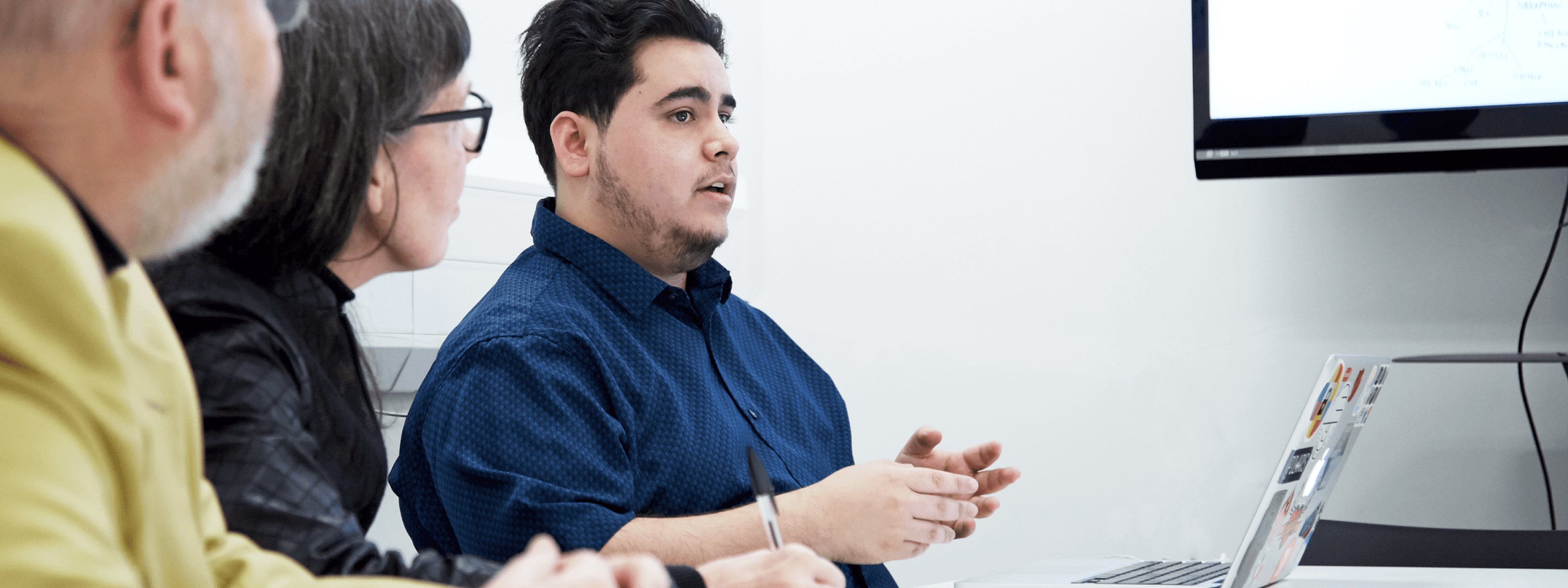 Photo of me presenting to stakeholders.