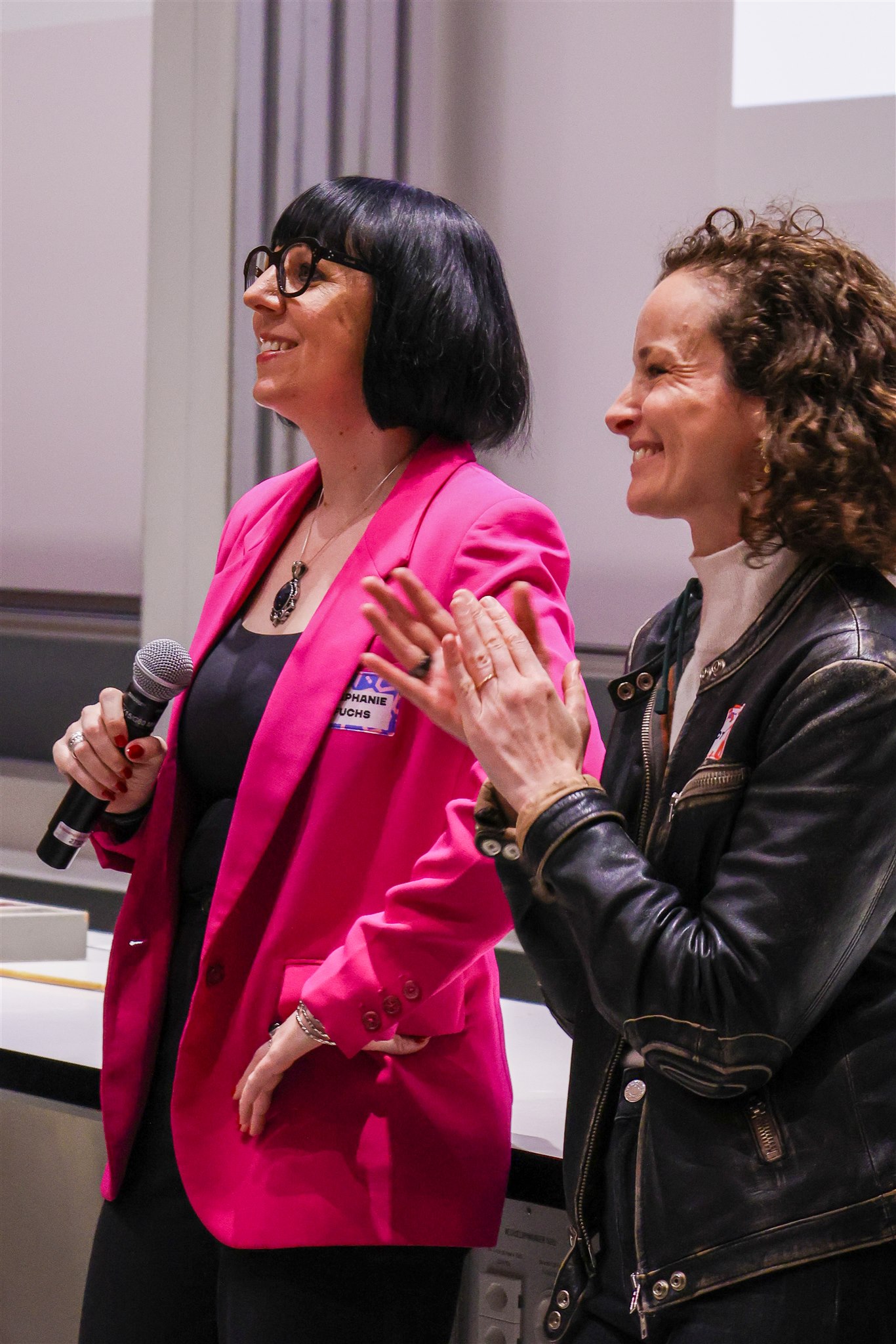 Panel speakers reacting during discussion at EthereumZüri blockchain conference