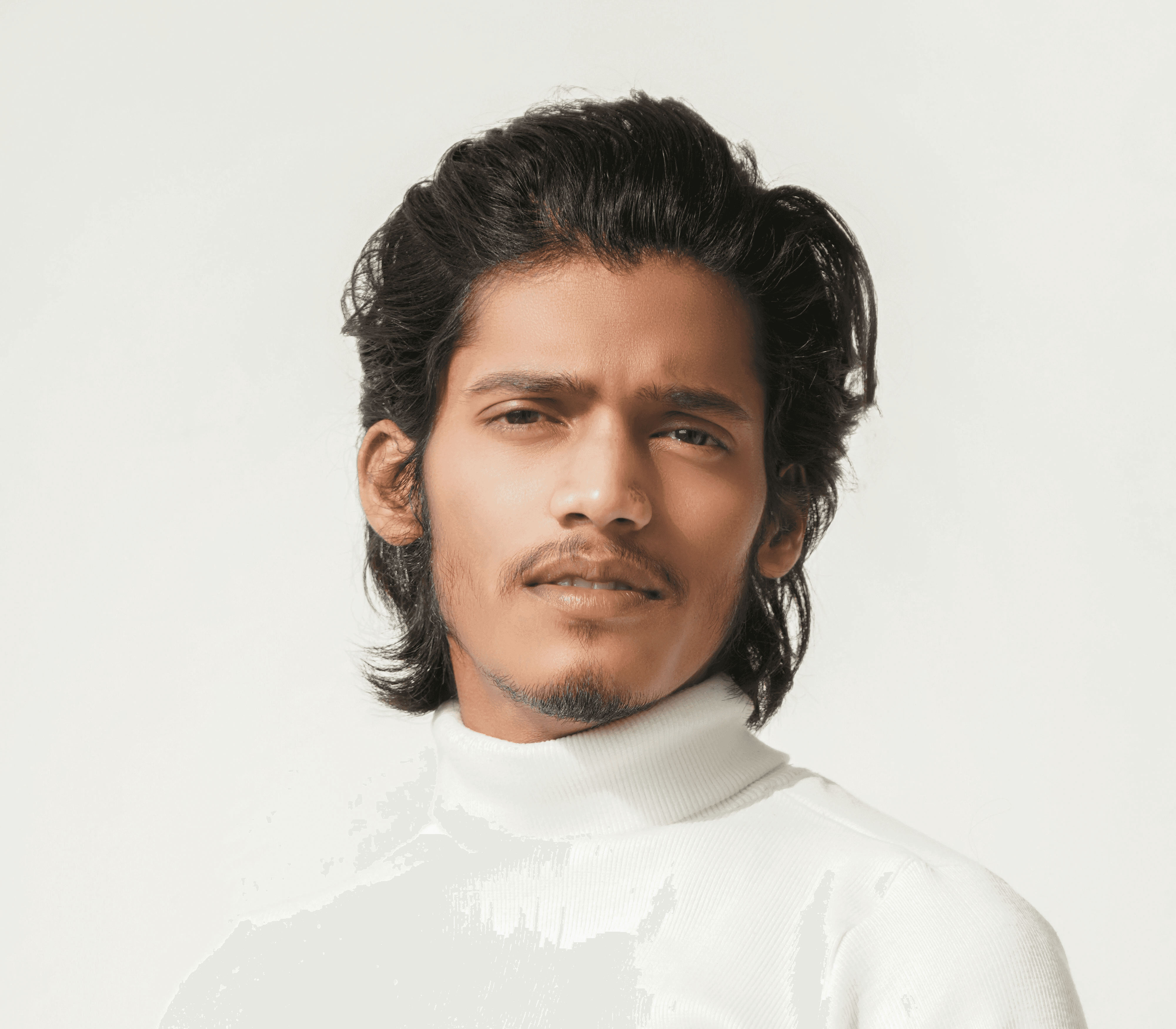 a man in a white turtle neck sweater