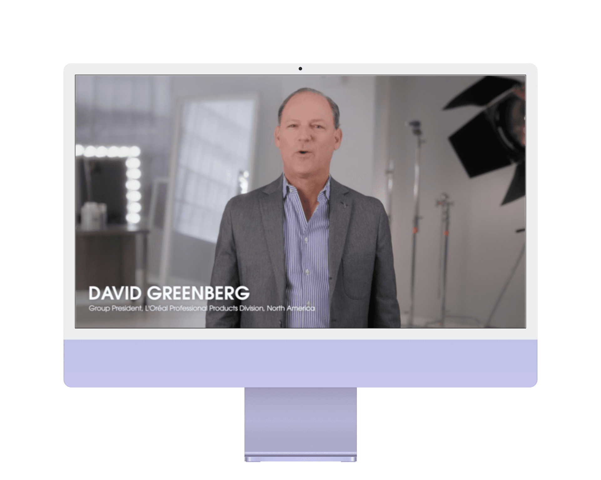 L'Oréal executive narrative video system still featuring David Greenberg, on lavendar iMac