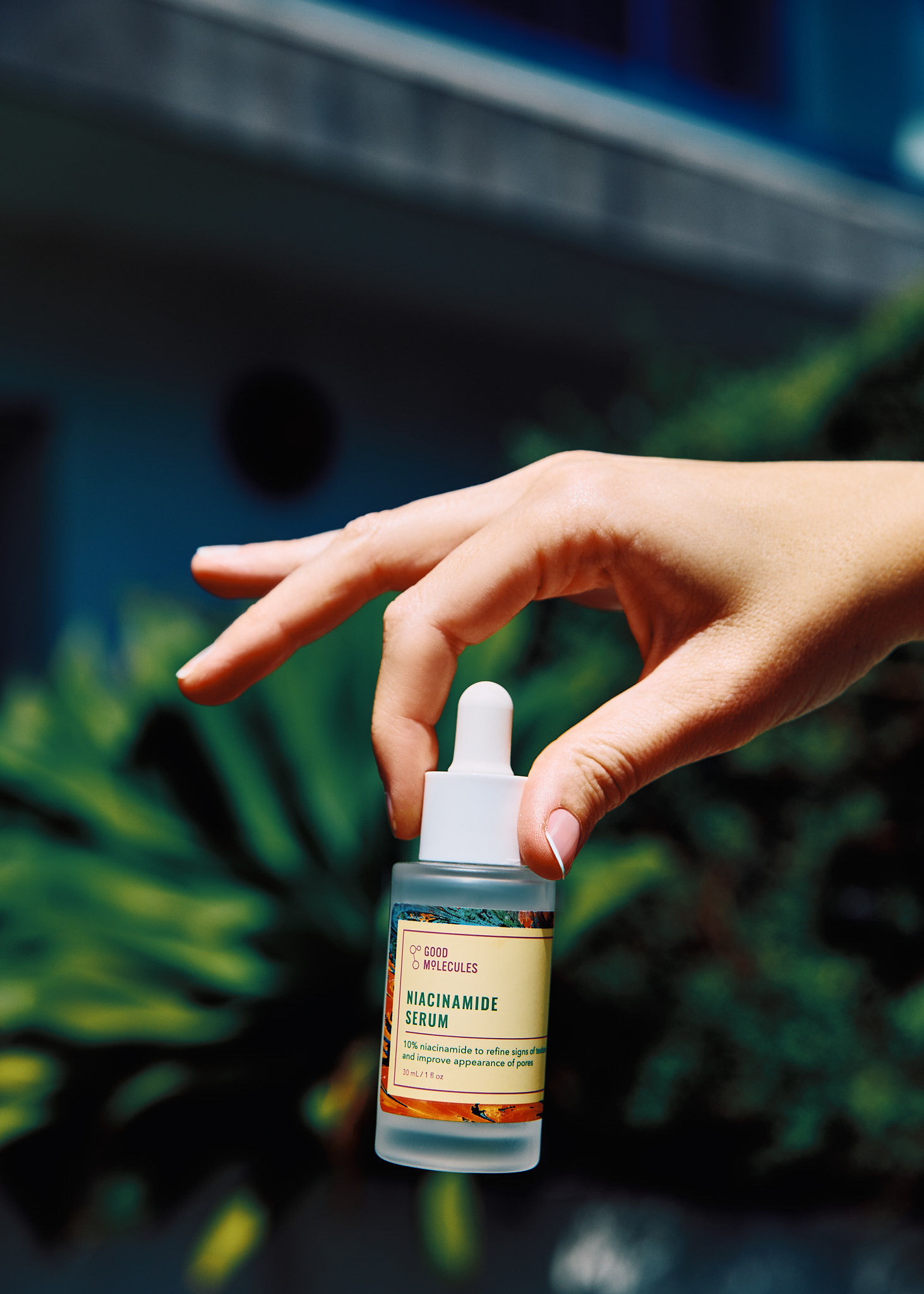 Woman with red hair covering mouth with hair