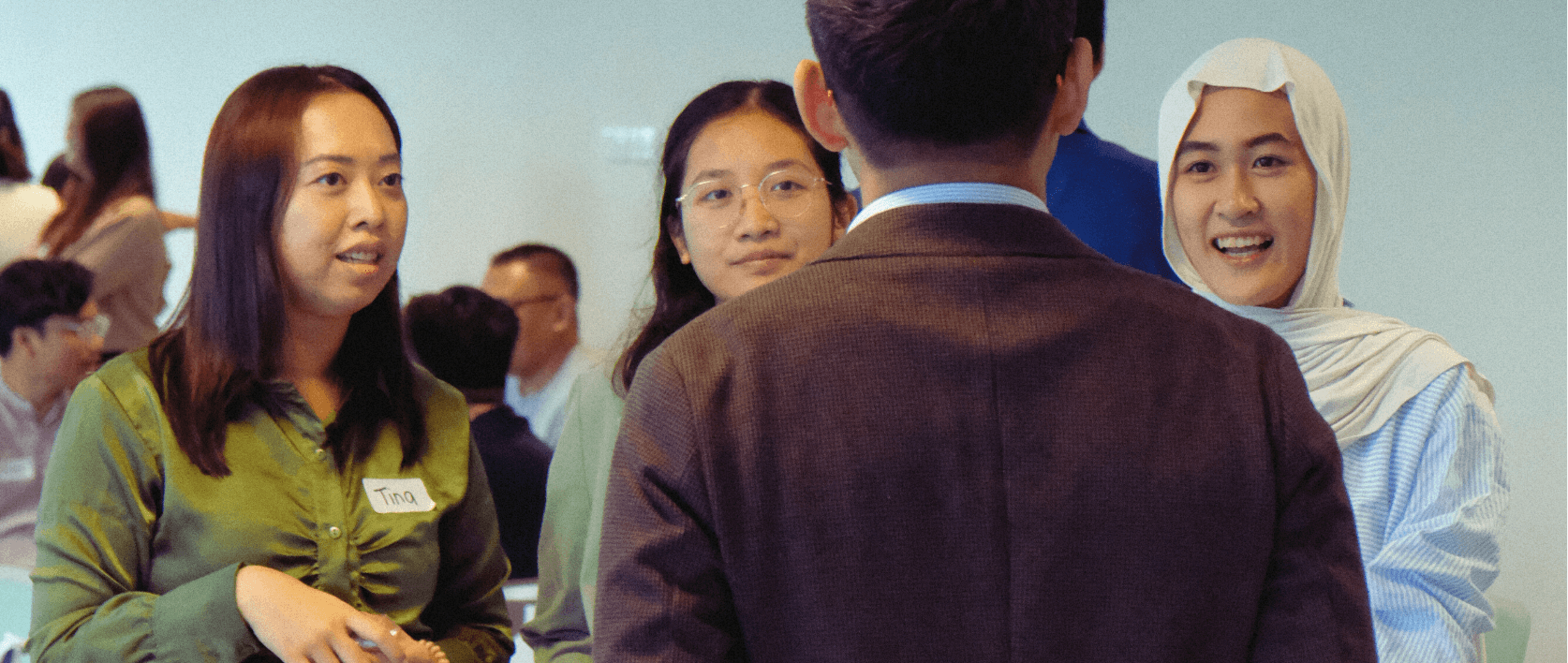 a woman sitting on a roof talking on a cell phone