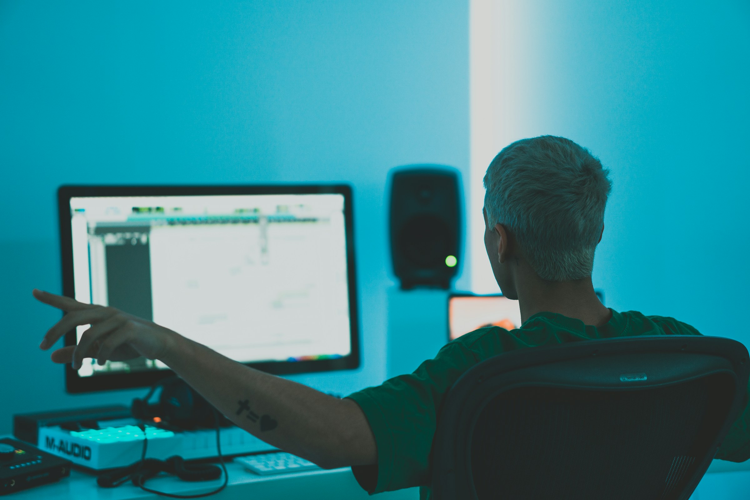 man listening to his song - How to Find a Music Producer
