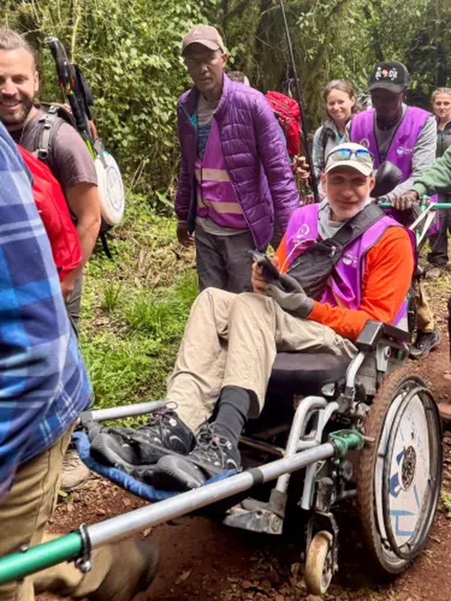 Abu El Haj Mahmoud makes his way toward the Mandara Huts along Mount Kilimanjaro’s Marangu Route, July 2026. Photo courtesy of Accessibility Accelerator.