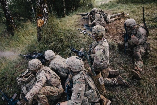 Infantry platoon moving in bounding overwatch during a movement to contact