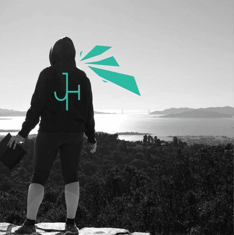 Jennifer Howard standing pen-in-hand overlooking the San Francisco Bay.